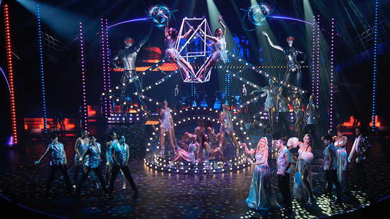 “All In!” is a high-energy, high-tech production.