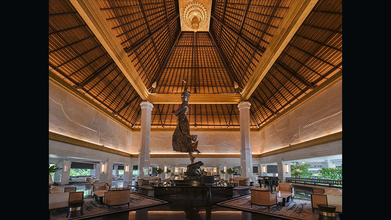 A 30-foot golden sculpture by an Indonesian artist is the centerpiece of the InterContinental Bali Resort’s lobby.