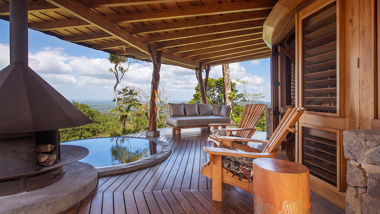 Enjoy panoramic views of Costa Rica from a wood-fire-heated plunge pool.