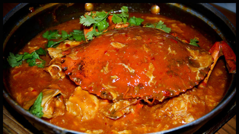 Feast on Chili Crab, a Singapore delicacy.