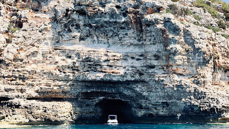 Gaze at picture-perfect white cliffs and hidden coves that are only accessible by boat.