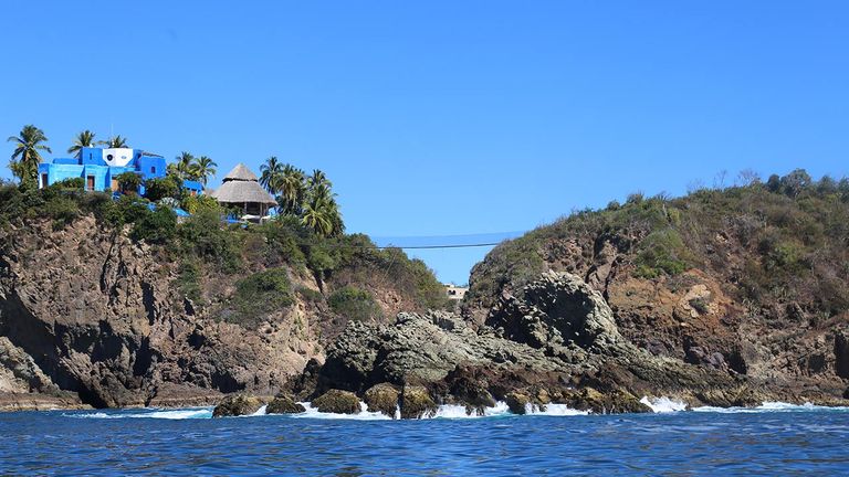 Gian Franco Brignone, the founder of Careyes, lived in Casa Mi Ojo, a blue castle crowned by an illustration of his one eye.