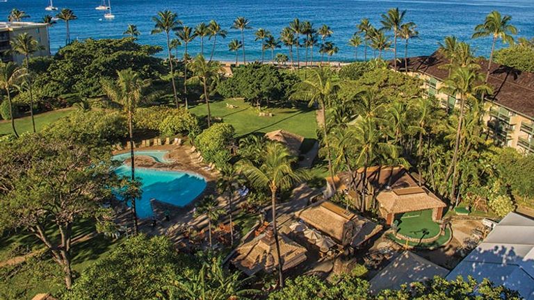 Guests can take a dip in the on-site whale-shaped pool or stroll the tropical gardens. // © 2018 Kaanapali Beach Hotel