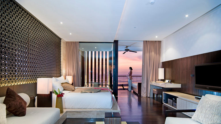 Ocean suites feature balconies with stunning views of the sea at Anantara Seminyak Bali Resort.