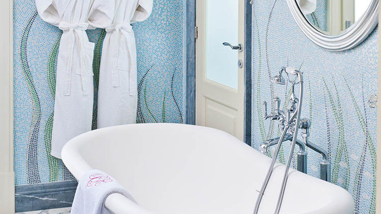 Renovated bathrooms feature soaker tubs with bath salts. // © 2017 The Pink Sands Club