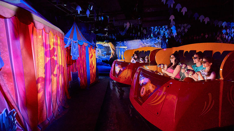 Riders on Knott’s Bear-y Tales: Return to the Fair are equipped with jelly blasters to hit virtual targets and score points.