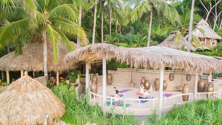 Sayulita’s Playa Escondida has a new, thatch-roofed “palapa” hut, designed specifically for yoga. // © 2016 Mexico Boutique Hotels