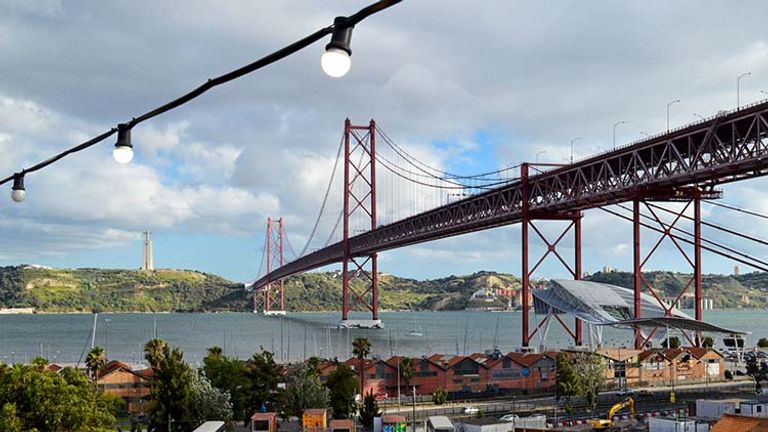 Situated adjacent to the 25 de Abril suspension bridge and Tagus River (Tejo River), LX Factory is a revitalized barrio with an eclectic array of shops, restaurants, cafes and more. // © 2018 Creative Commons user Alex Lehner