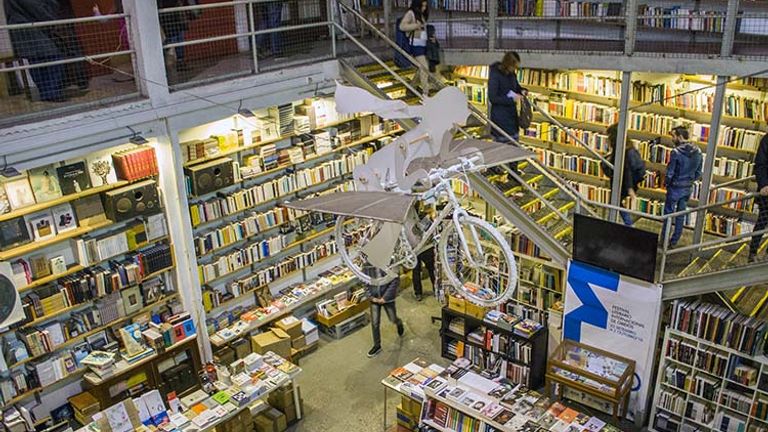 Spend hours shopping for books, eating cake and sipping on wine or coffee in the multistory Ler Devagar bookstore. // © 2018 Creative Commons user shadowgate