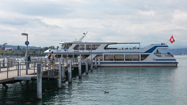 To travel Lake Zurich, board one of the boats at the dock at the Burkliplatz Station in Zurich. // © 2018 Ben McBee