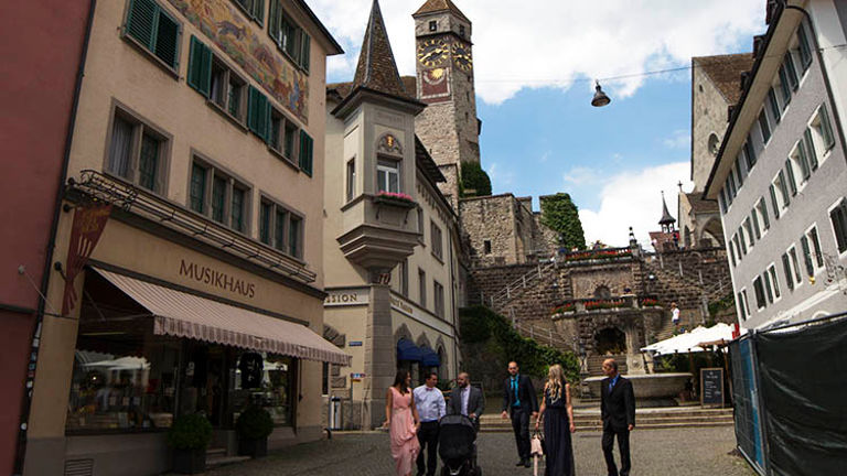 Wedding celebrators go for a stroll following the ceremony in Rapperswil’s hilltop church. // © 2018 Ben McBee